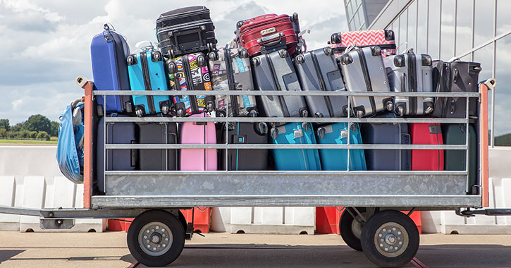 suitcases on a cart at the airport