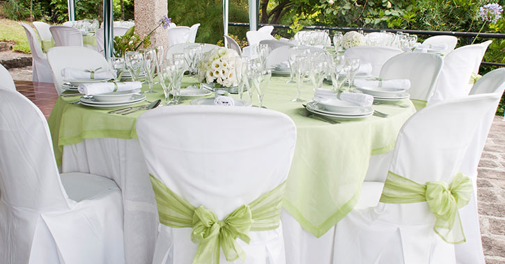 wedding table with white and green linens