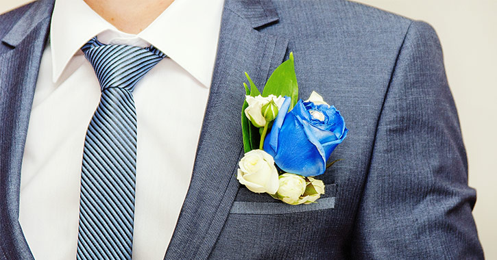 groom with blue boutonniere