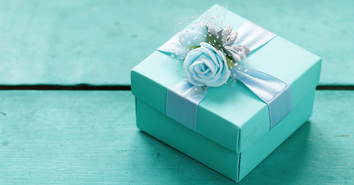 teal box with a rose on top