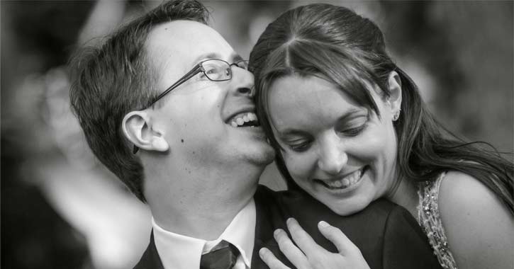 bride and groom laughing