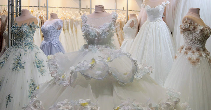 a wide variety of wedding dresses in a shop