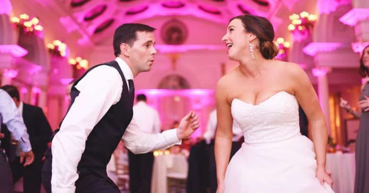 a bride and groom dancing together at a wedding