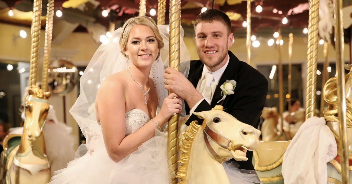 bride and groom on a carousel